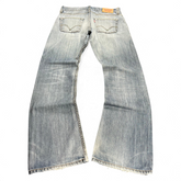 TWC Vintage Levi's Jeans in verwaschenem Blau mit geradem Bein und ausgefransten Säumen in der Rückansicht
