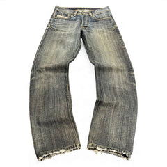TWC Vintage Diesel Slim Jeans in verwaschenem Blau mit Distressed-Details und ausgefransten Beinabschlüssen