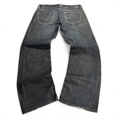 TWC Vintage Diesel Larkee Straight Jeans in dunklem Denim mit klassischer Waschung und abgenutzten Säumen