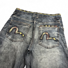 TWC Vintage Evisu Jeans mit geradem Schnitt, verwaschenem Denim und karierten Seagull-Logos auf den Gesäßtaschen.