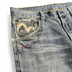 TWC Vintage Jeans aus blauem Denim mit japanischer Stickerei an der Münztasche und Used-Look Details