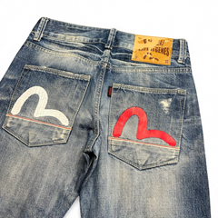 TWC Vintage Evisu straight leg jeans in distressed blue denim with iconic white and red painted seagull back pockets.
