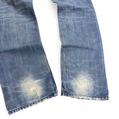 TWC Vintage Diesel Straight Jeans in verwaschenem Blau mit Distressed-Details und Abnutzungen an den Knien