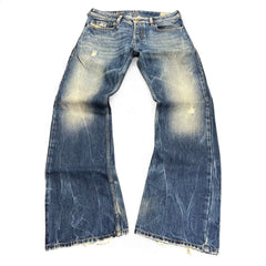 TWC Vintage Diesel Zatiny Bootcut Jeans in verwaschenem Blau mit Distressed-Details und ausgefranstem Saum
