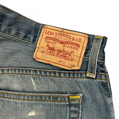 TWC Vintage Levi’s 527 Bootcut Jeans mit braunem Lederpatch und klassischer blauer Denim-Waschung