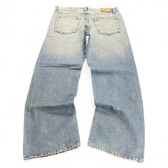 TWC Vintage Dolce&Gabbana Baggy Jeans in hellblauem Denim mit weitem Bein und Leder-Label auf der Rückseite