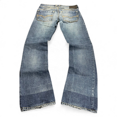 TWC Vintage Diesel Zatiny Bootcut Jeans in blauem Denim mit verwaschener Optik und markanten Gesäßtaschen