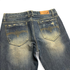 TWC Vintage Bootcut-Jeans in verwaschenem Blau mit dekorativen Stickereien auf den Gesäßtaschen und Used-Look
