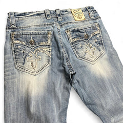 TWC Vintage Rock Revival Jeans in verwaschenem Blau mit aufwendigen Stickereien und Klappentaschen auf der Rückseite