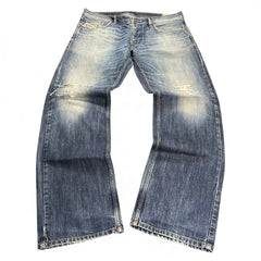TWC Vintage Diesel Larkee Straight Jeans in blauem Denim mit Used-Look und Distressed-Details am Knie