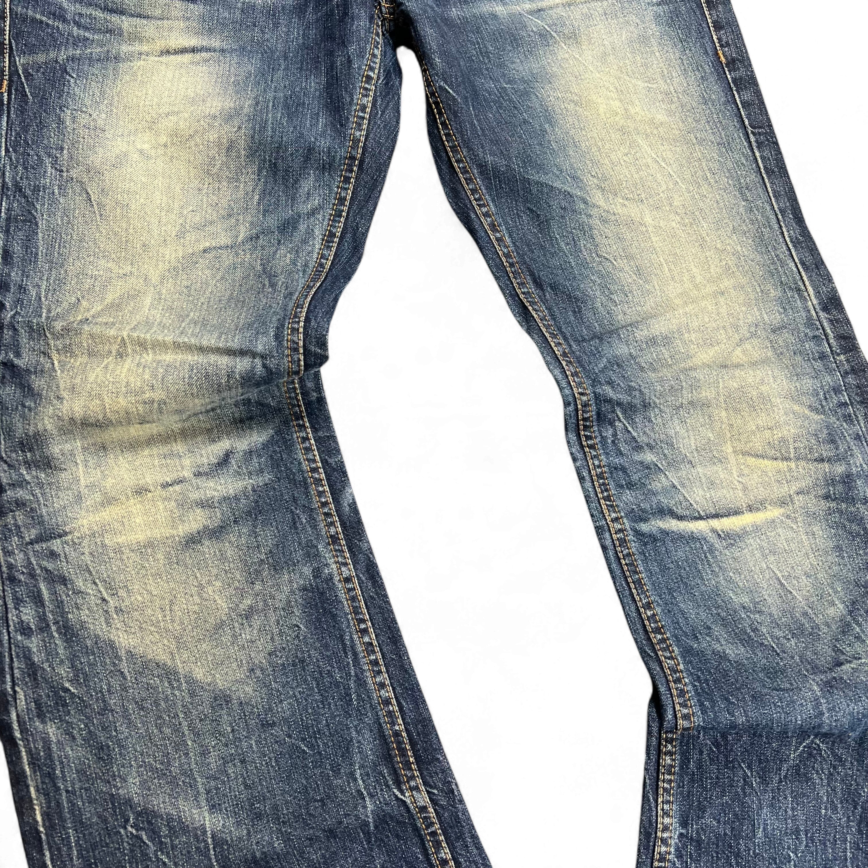 TWC Vintage Buckaroo Bootcut Jeans in blau mit verwaschener Optik und markanten Sitzfalten
