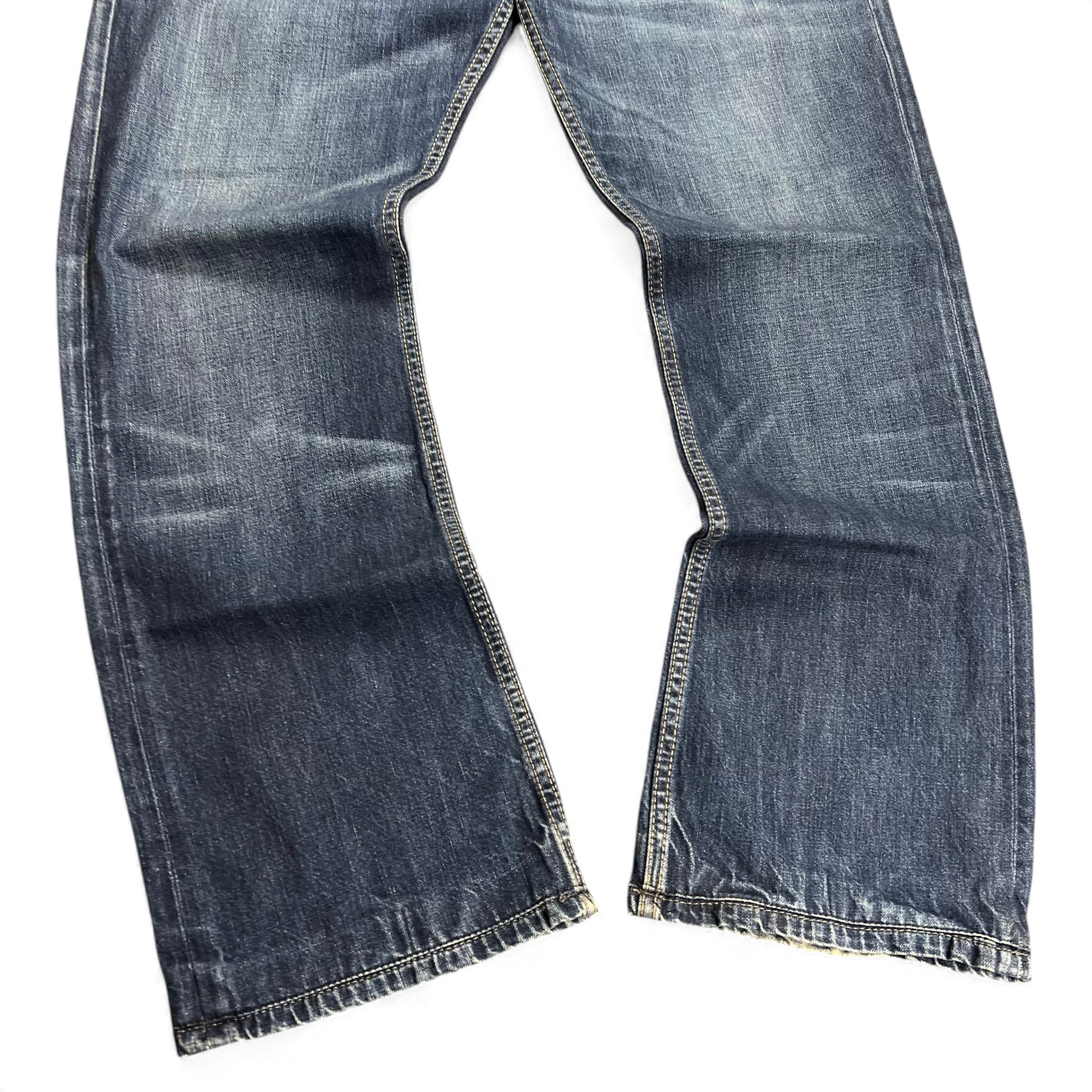 TWC Vintage Diesel New-Fanker Bootcut Jeans in blauem Denim mit Used-Optik und ausgestelltem Bein