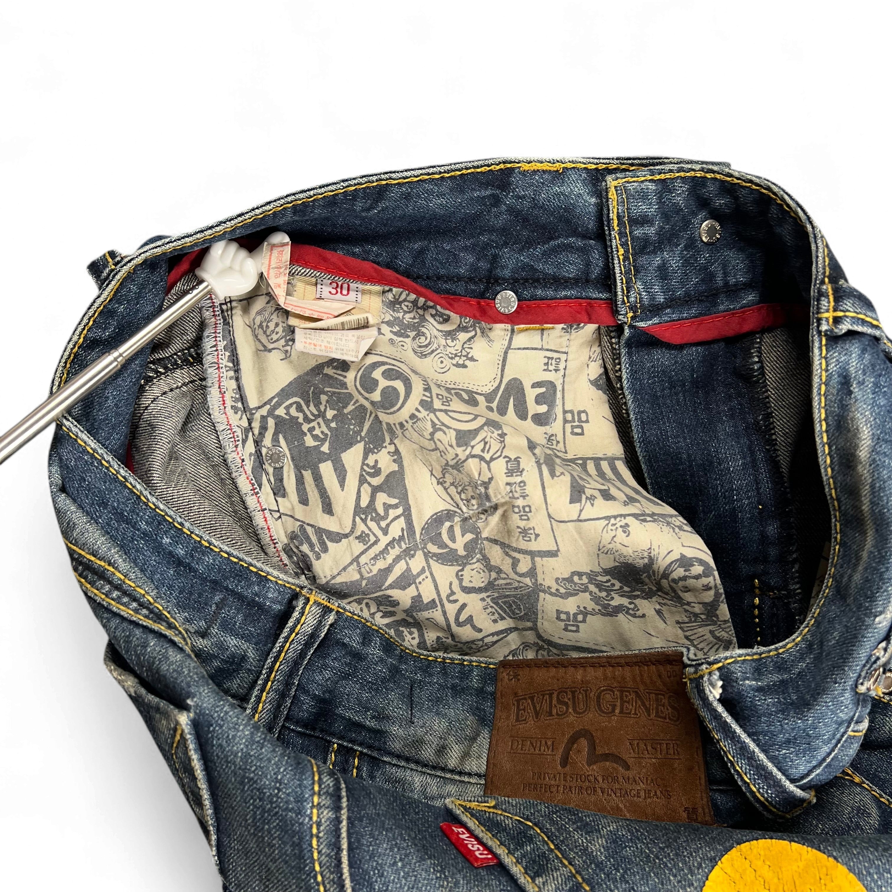 TWC Vintage Evisu KC Straight Jeans mit charakteristischem Comic-Innenfutter und braunem Leder-Patch am Bund