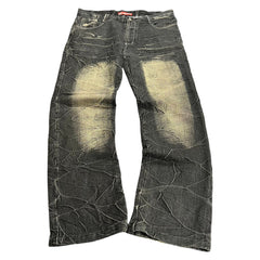 TWC Vintage Jeans aus schwarzem Denim mit japanischem Stickerei-Stil und markanter Waschung im Used-Look