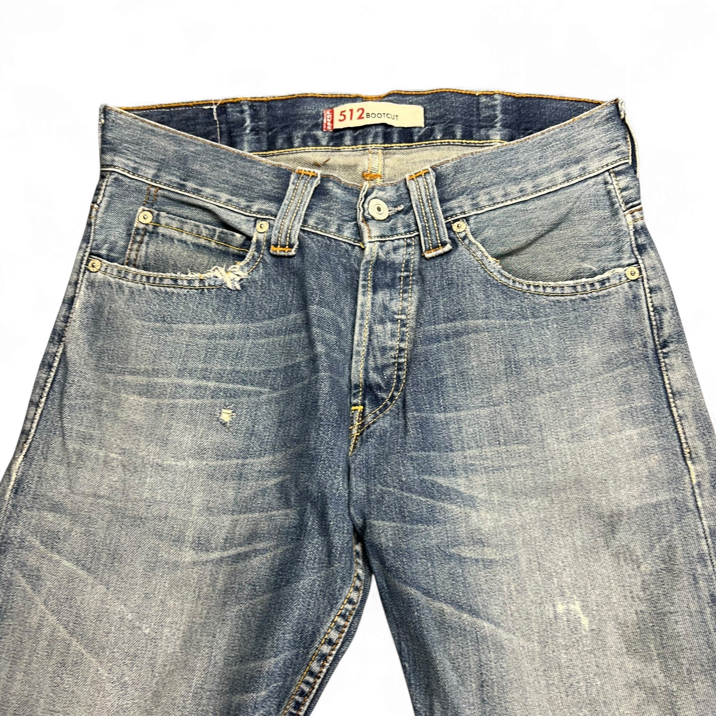 TWC Vintage Levi's 512 Bootcut Jeans in dirty wash denim with distressed details and classic five-pocket design