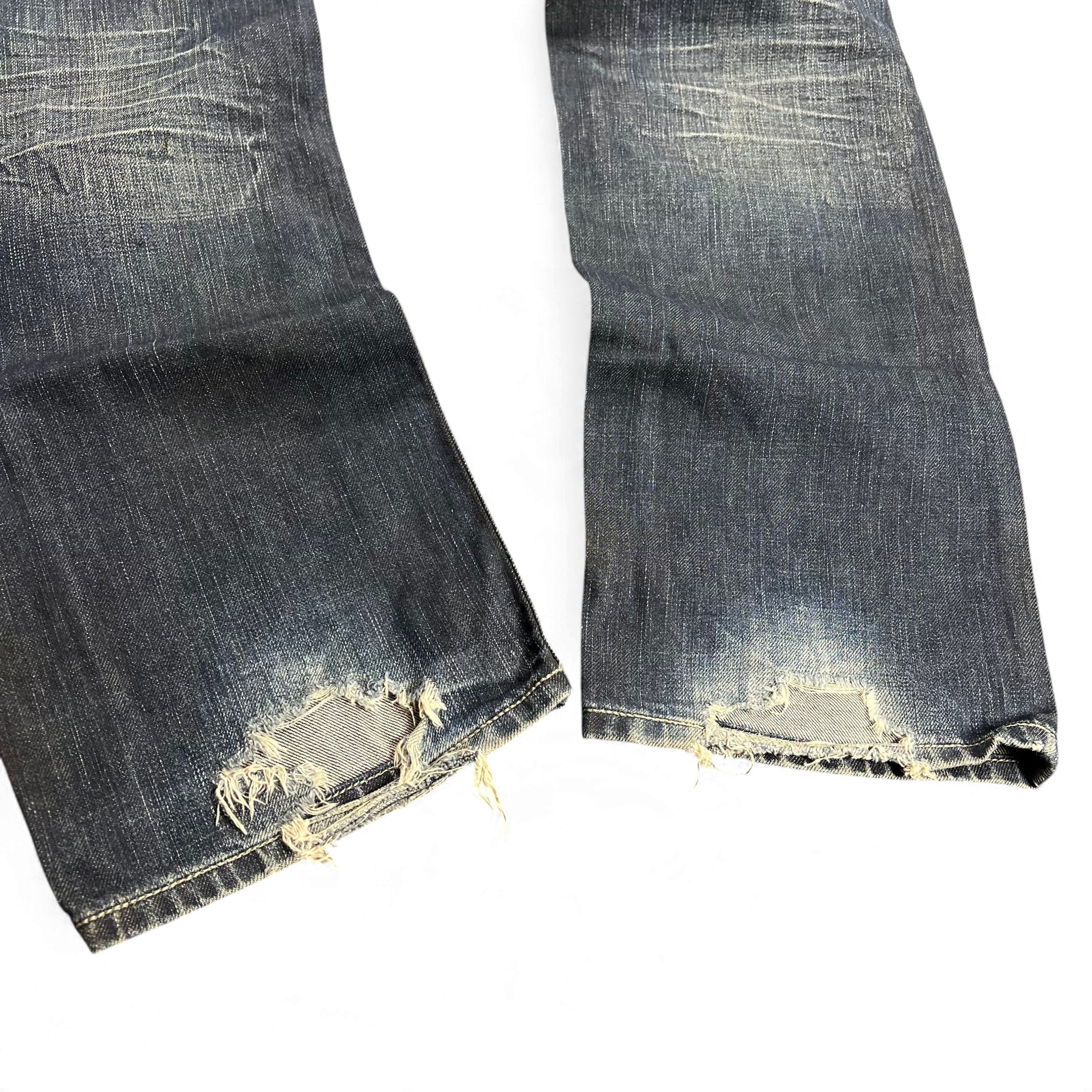 TWC Vintage Diesel Yarik Straight Jeans in dunkelblauem Denim mit Distressed-Details und ausgefransten Beinabschlüssen