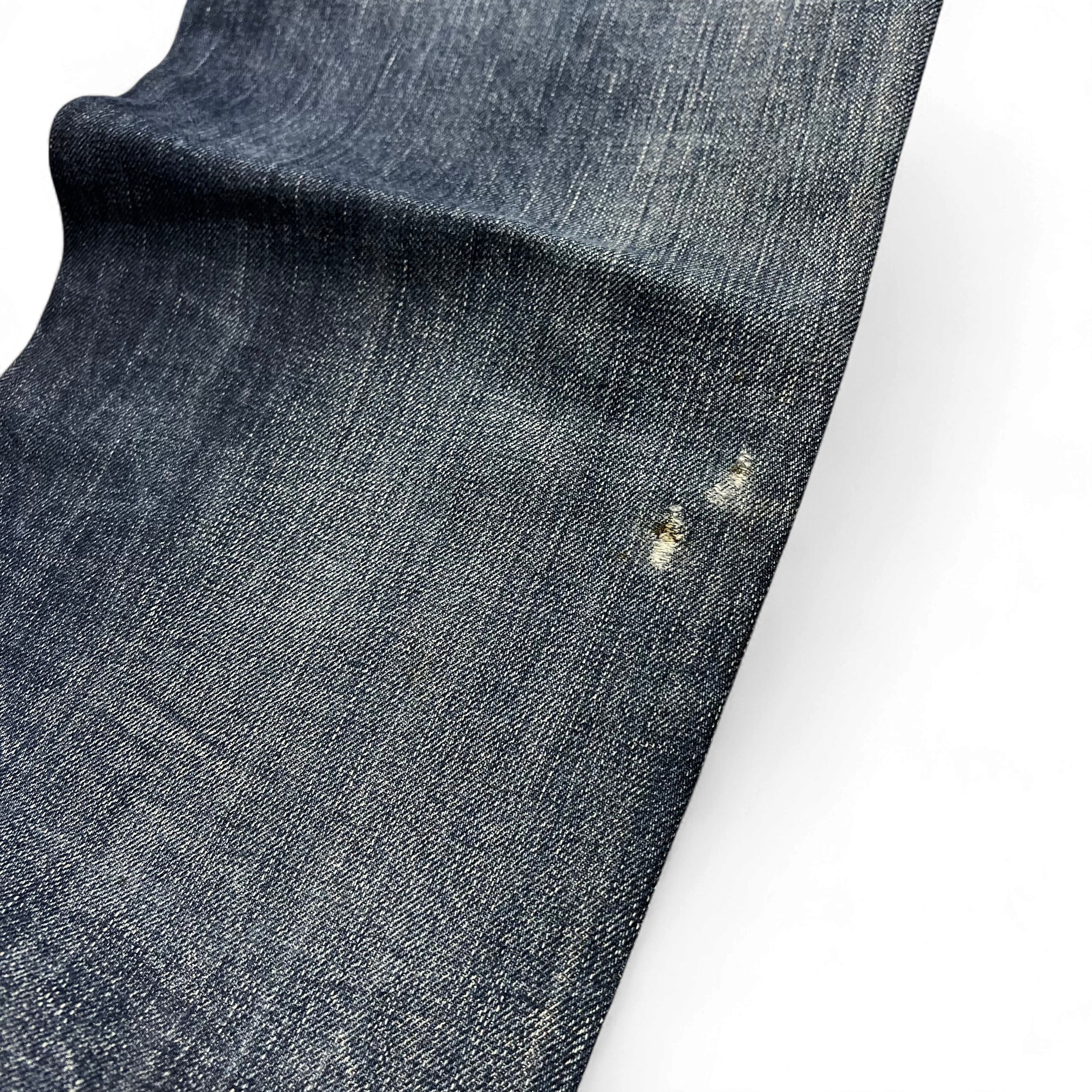 TWC Vintage Diesel Larkee Straight Jeans aus dunkelblauem Denim mit kleiner Abnutzungsstelle am Bein