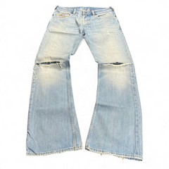 TWC Vintage Diesel Zatiny Bootcut Jeans in hellblauem Denim mit Distressed-Details und ausgefransten Säumen