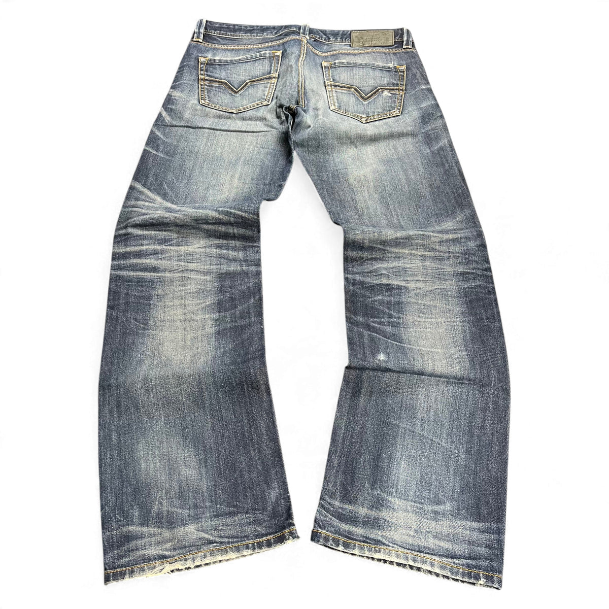 TWC Vintage Diesel Larkee Straight Jeans in verwaschenem Blau mit markanten Gesäßtaschen und geradem Bein