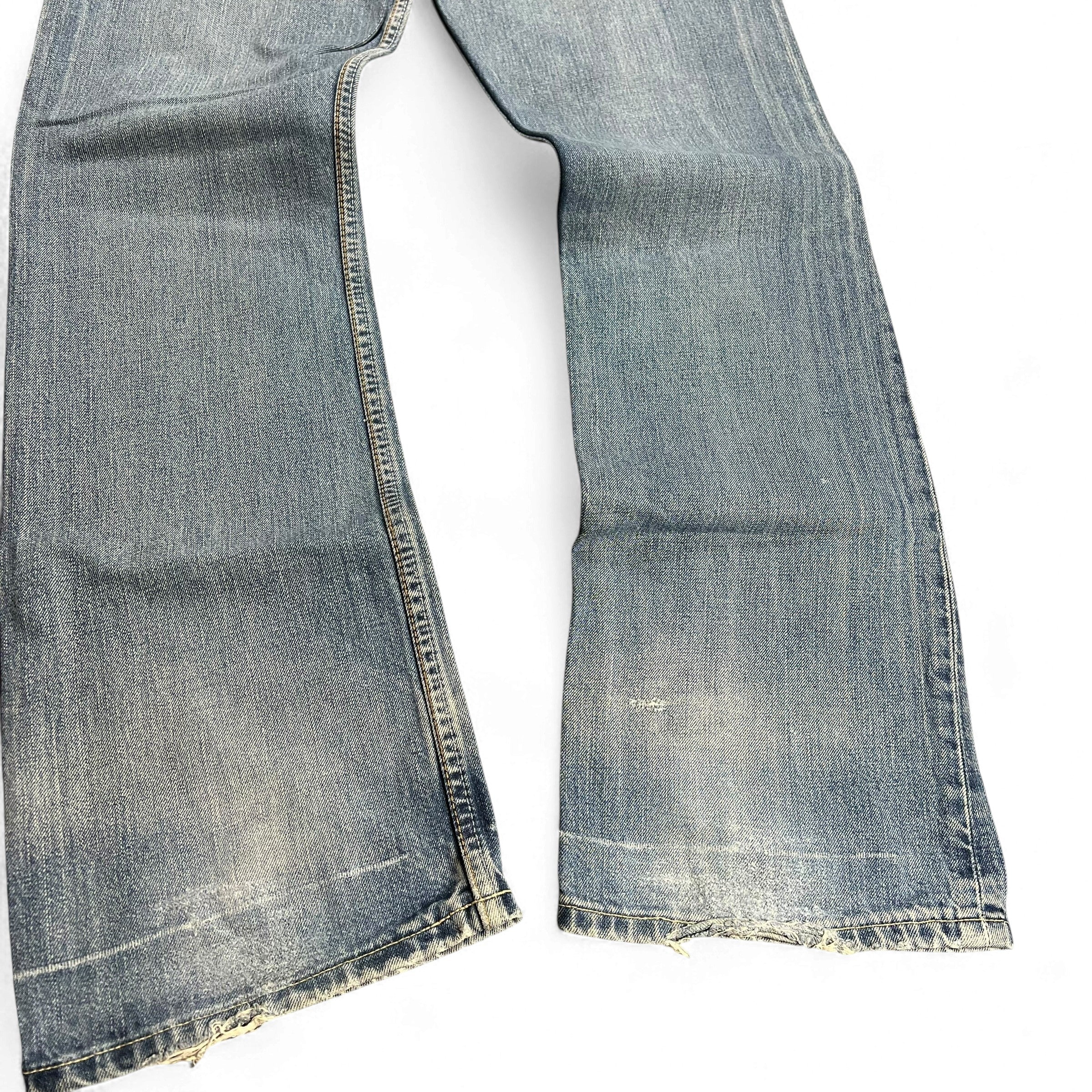 TWC Vintage Levi’s 507 Bootcut Jeans in light blue denim with distressed hem and vintage wash finish