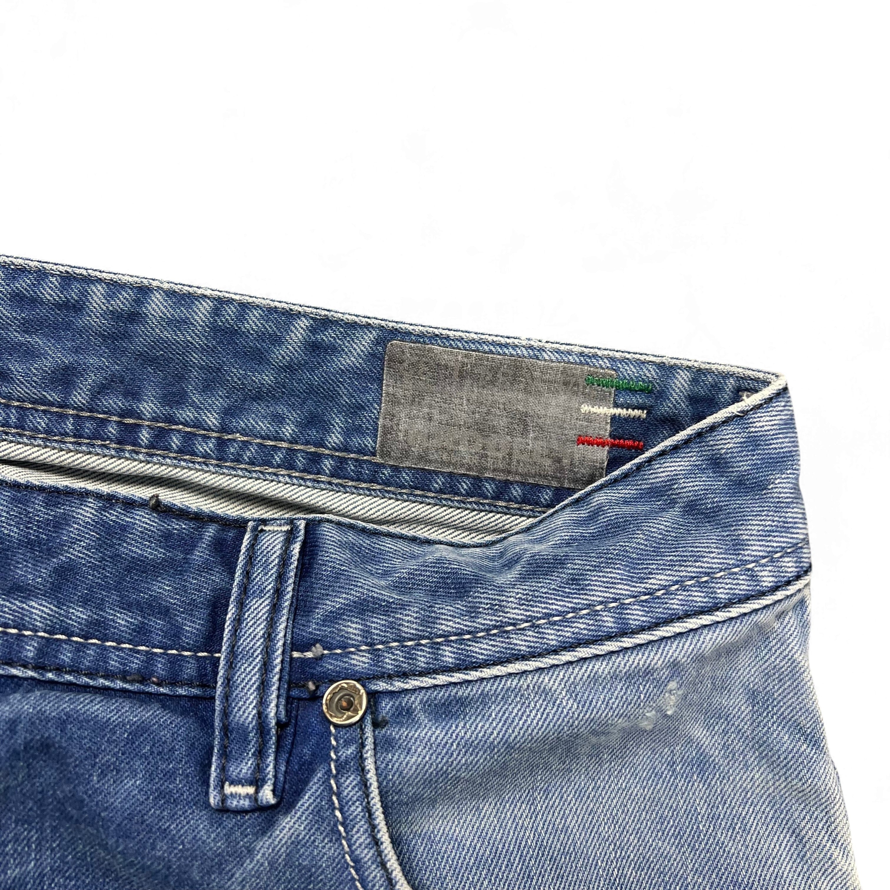 TWC Vintage Diesel Straight Jeans in Blau mit Detailansicht des Bundes und Markenlabel