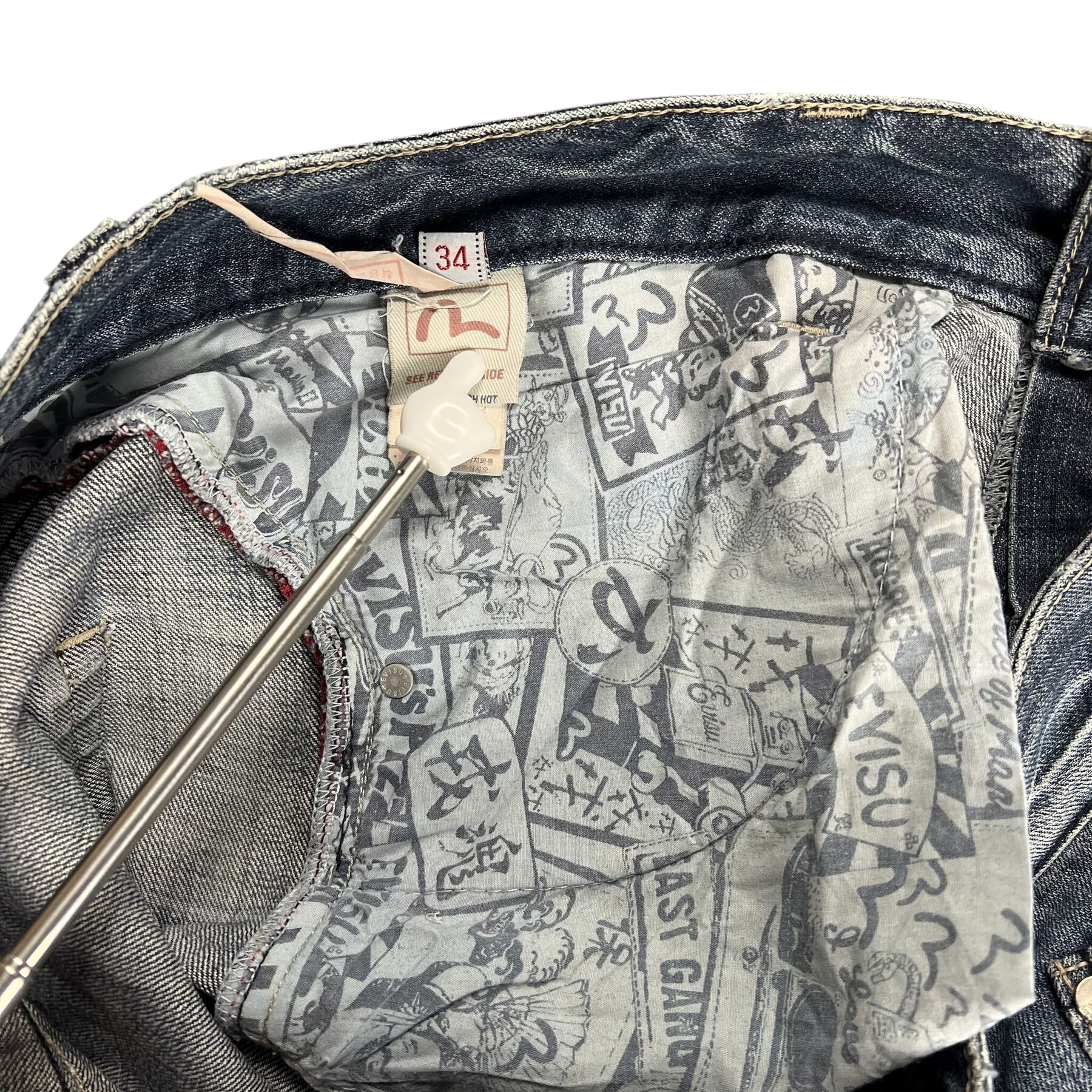 TWC Vintage Evisu Jeans mit bedrucktem Innenfutter und Markenlabel am Bund