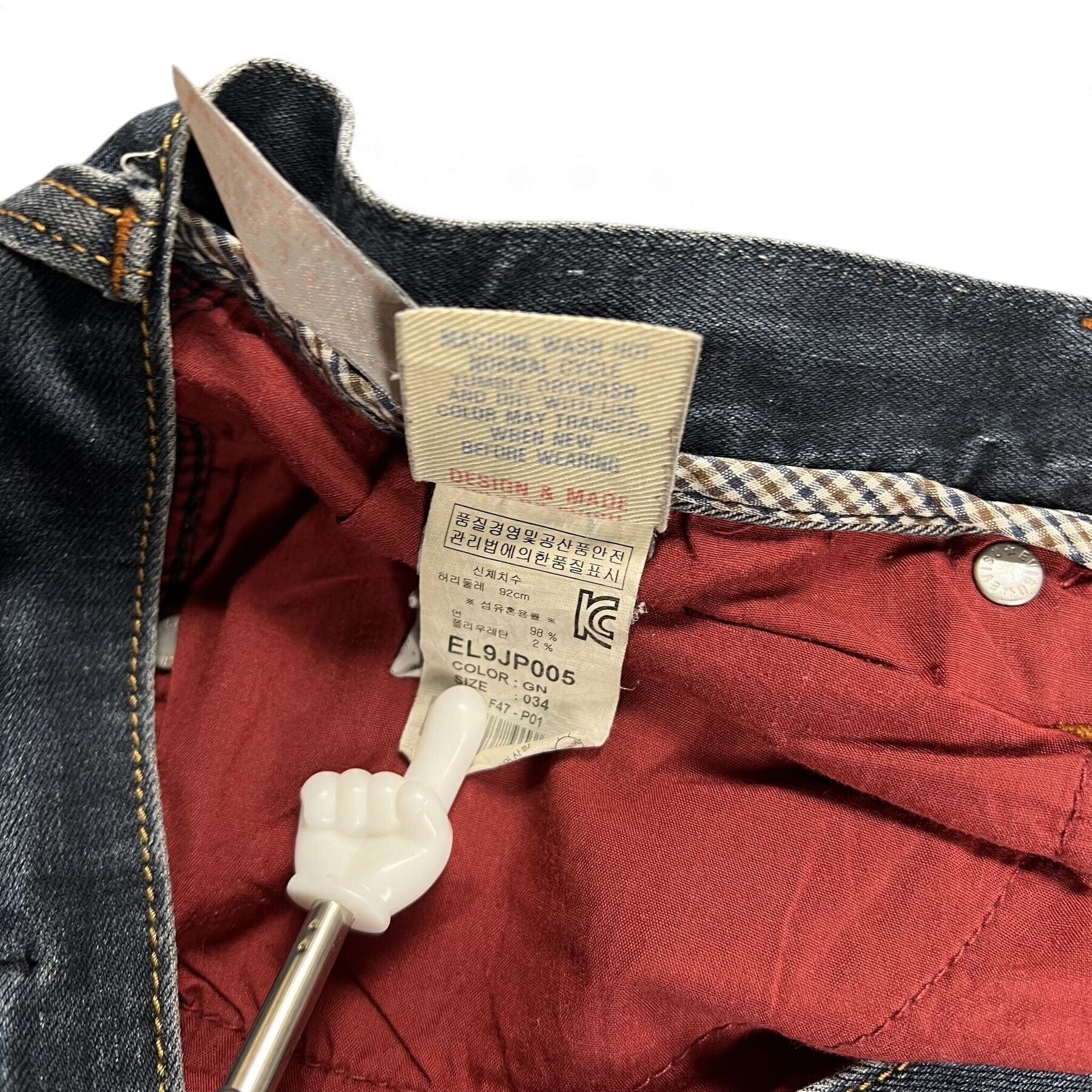 TWC Vintage Evisu Straight Jeans mit rotem Innenfutter und Pflegeetikett im Detail