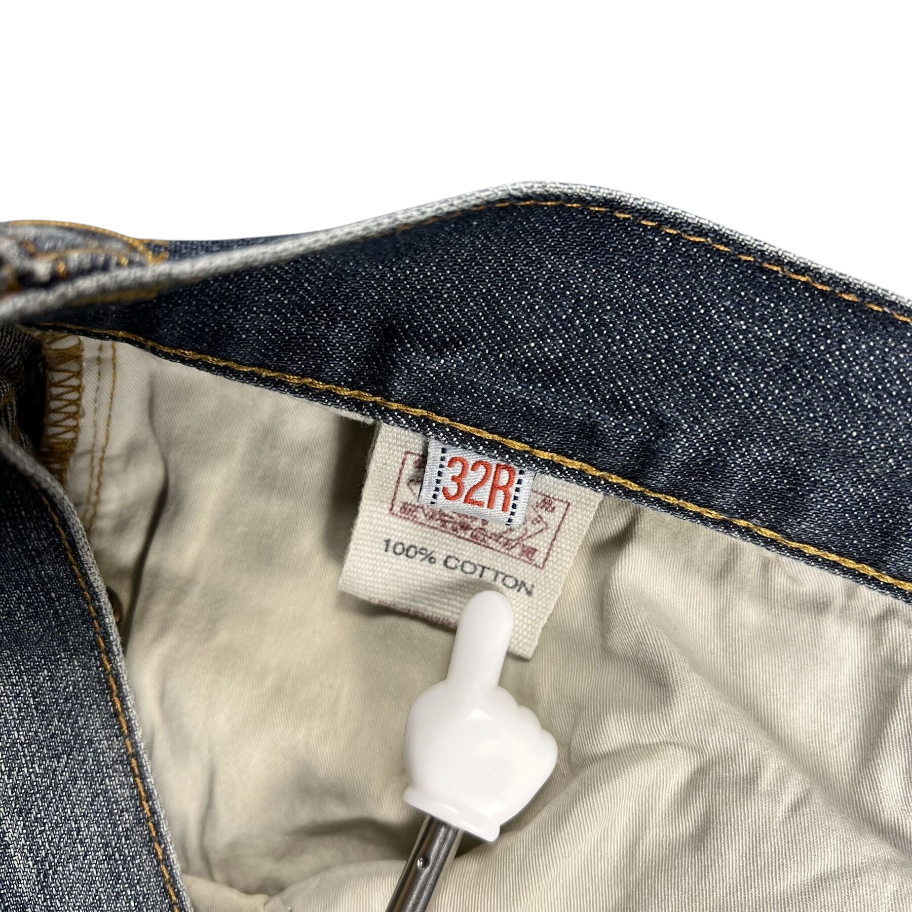 TWC Vintage Evisu Jeans Innenetikett mit 32R Größenangabe und 100 Prozent Baumwolle Materialhinweis