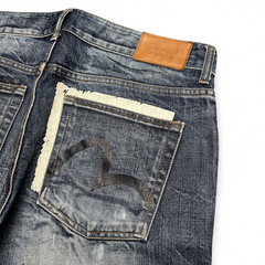 TWC Vintage Evisu Straight Jeans aus blauem Denim mit ausgefranster Gesäßtasche und Lederpatch