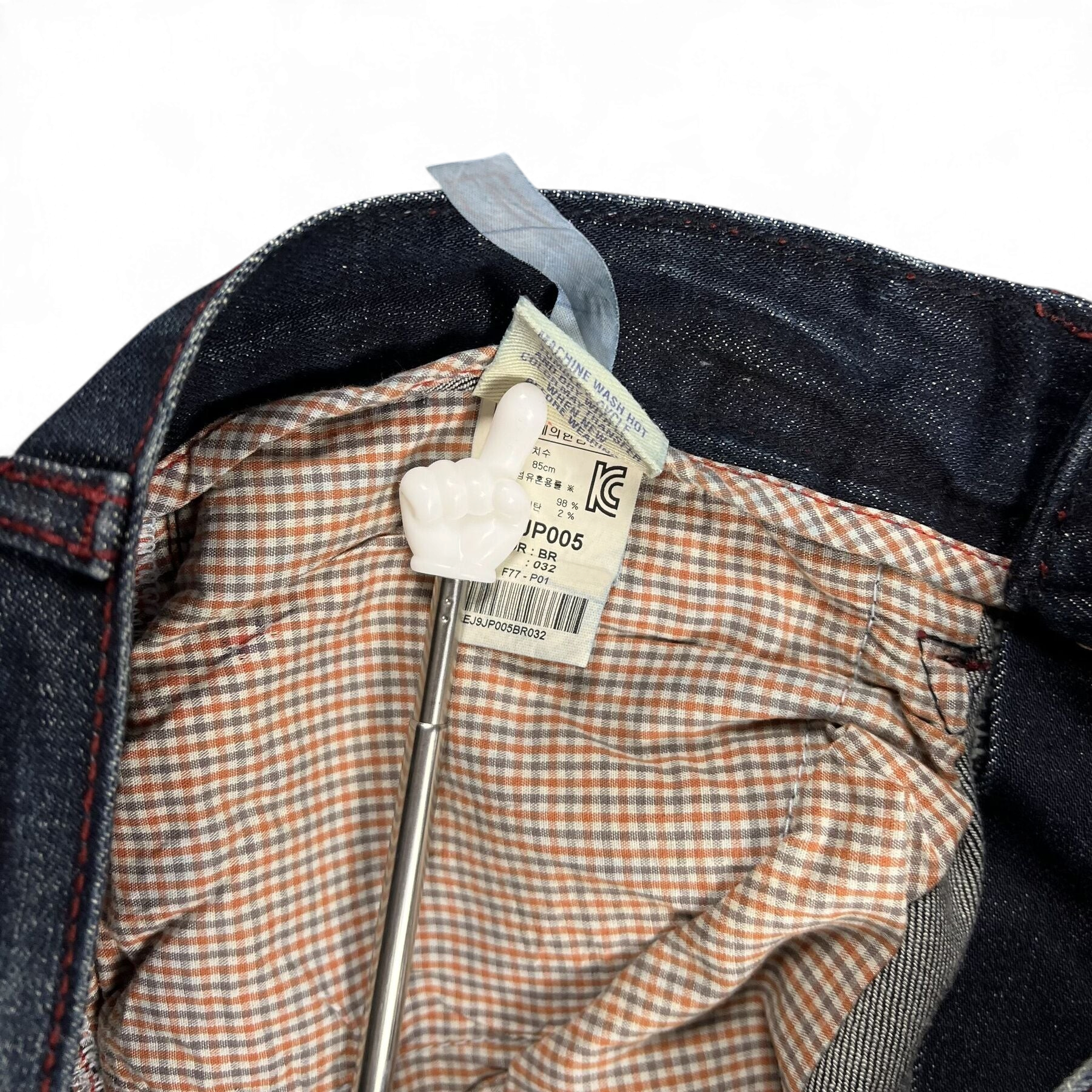 TWC Vintage Evisu Jeans Innenetikett mit kariertem Innenfutter und Pflegehinweisen