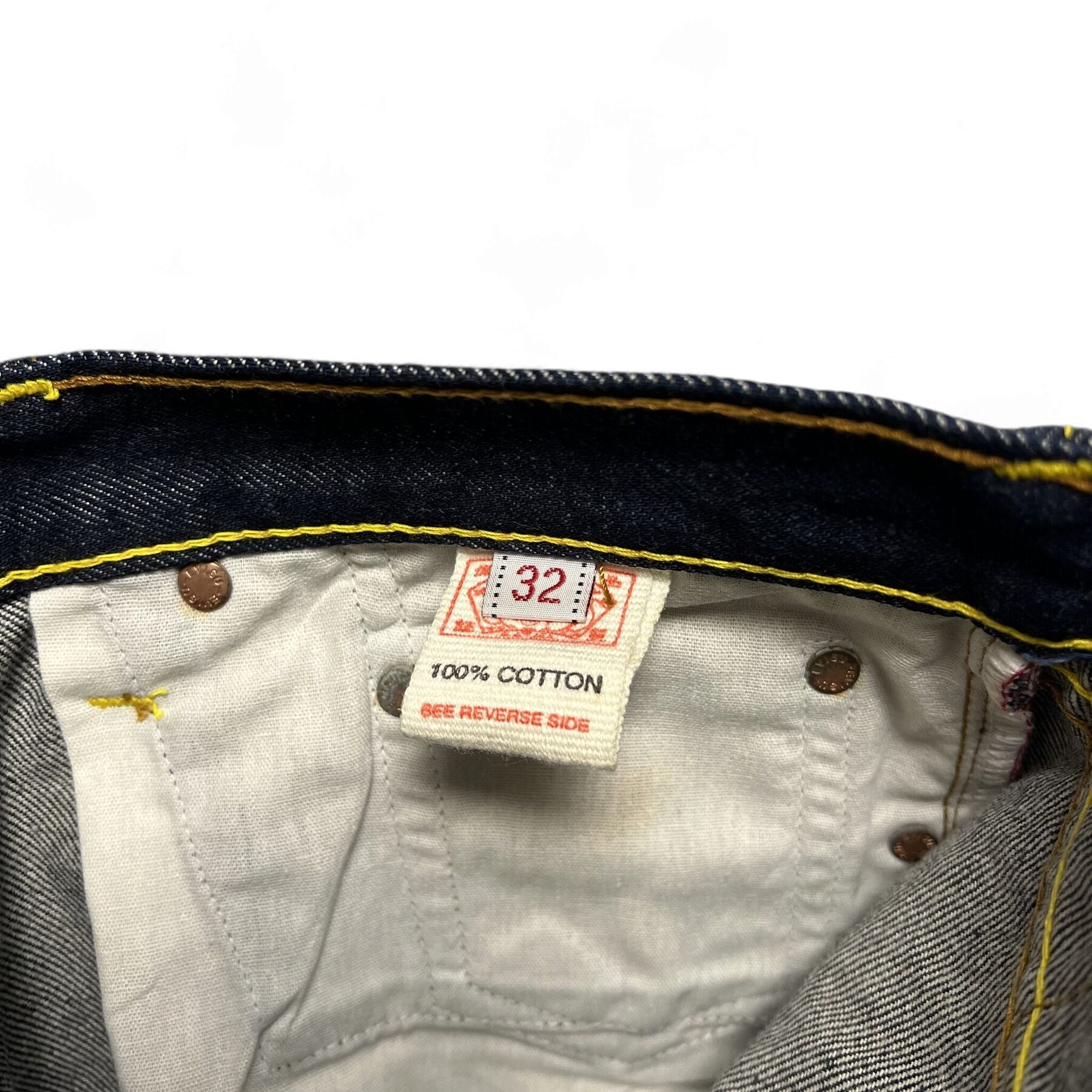 TWC Vintage Evisu Jeans Innenetikett mit 100 Prozent Baumwolle und Größenangabe 32