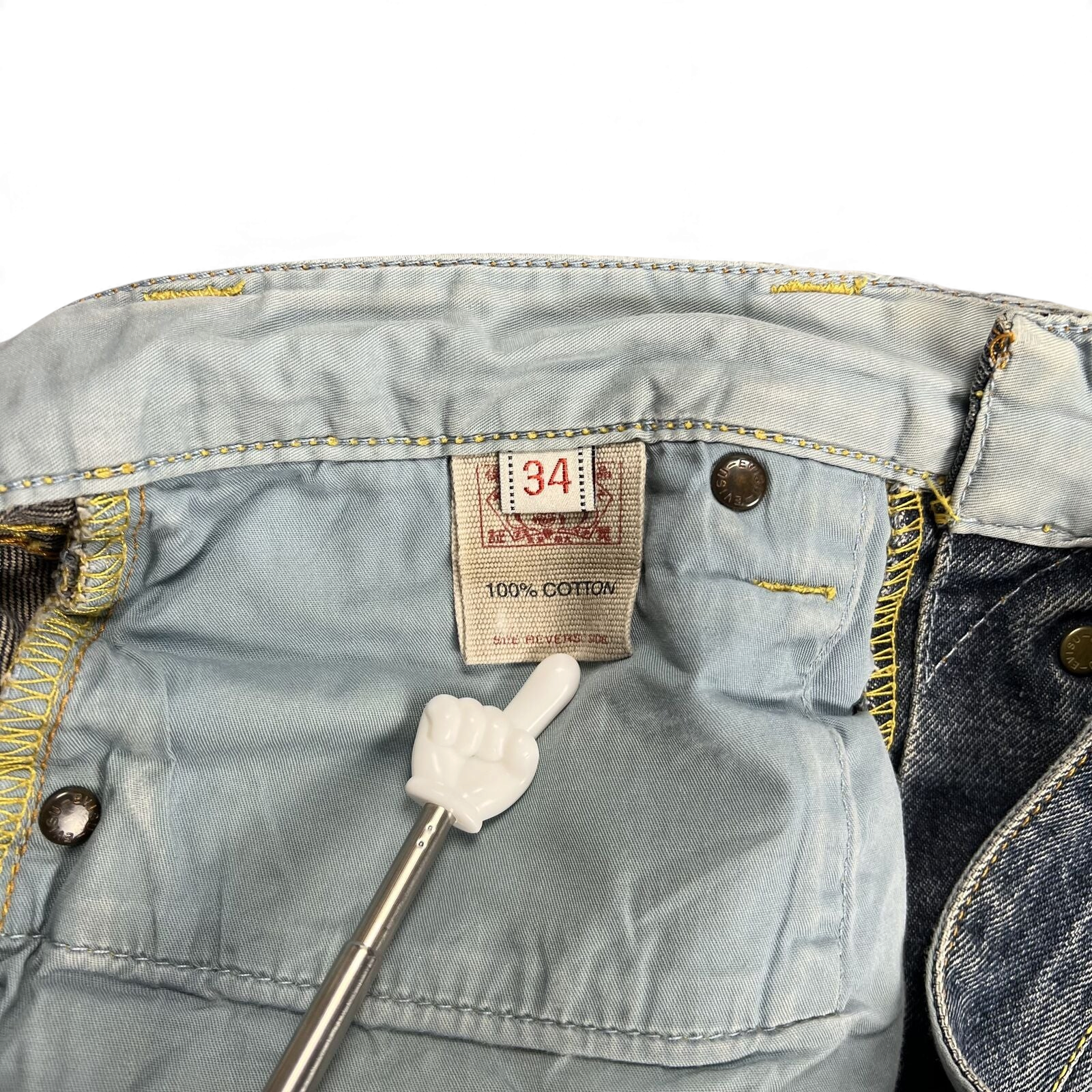 TWC Vintage Evisu Jeans Innenetikett mit 100 Prozent Baumwolle und Größenangabe