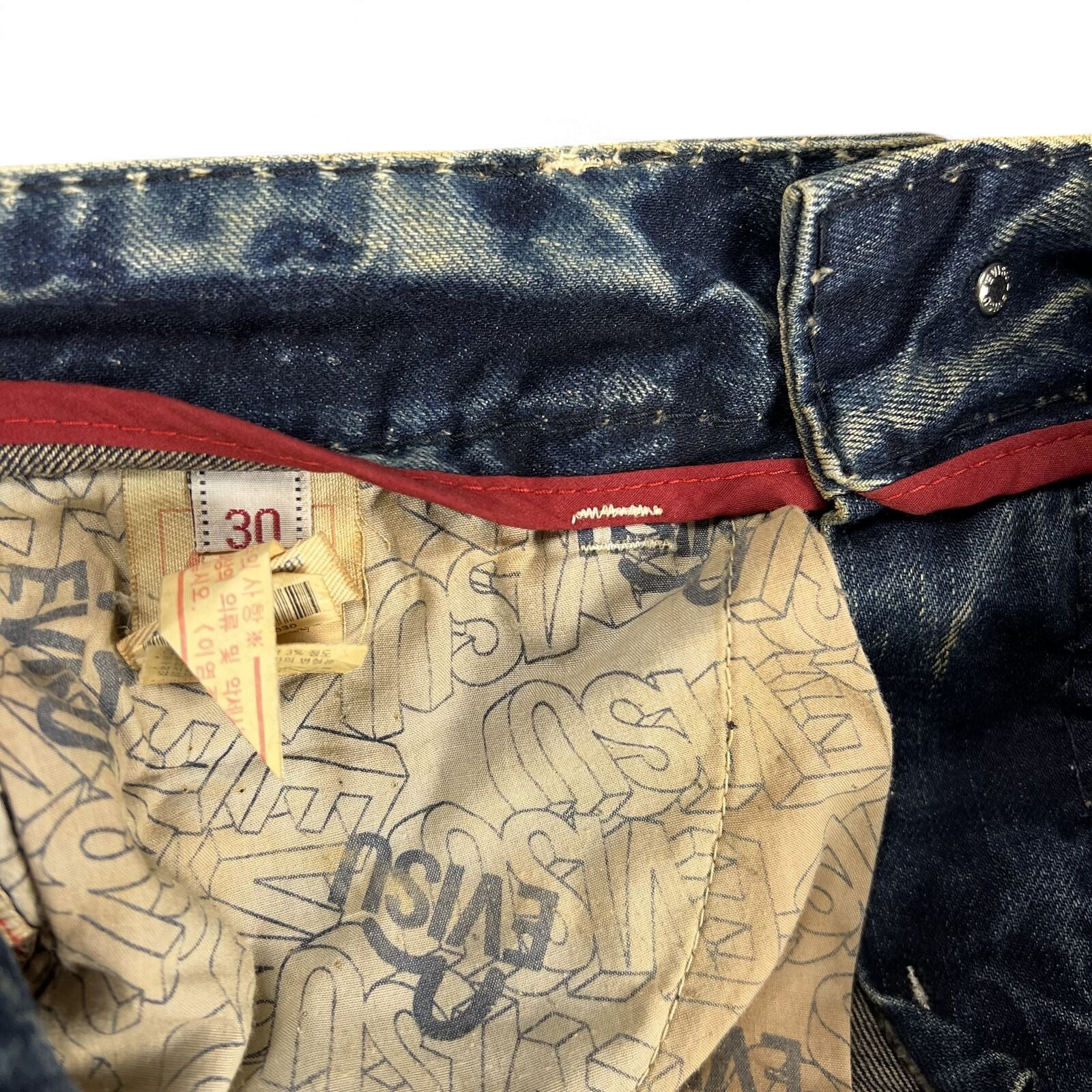 TWC Vintage Evisu Jeans mit verwaschenem Denim, rotem Innenfutter und bedrucktem Taschenfutter