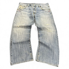 TWC Vintage Jeans aus hellblauem Denim mit japanischer Stickerei und Used-Look-Details im weiten Schnitt