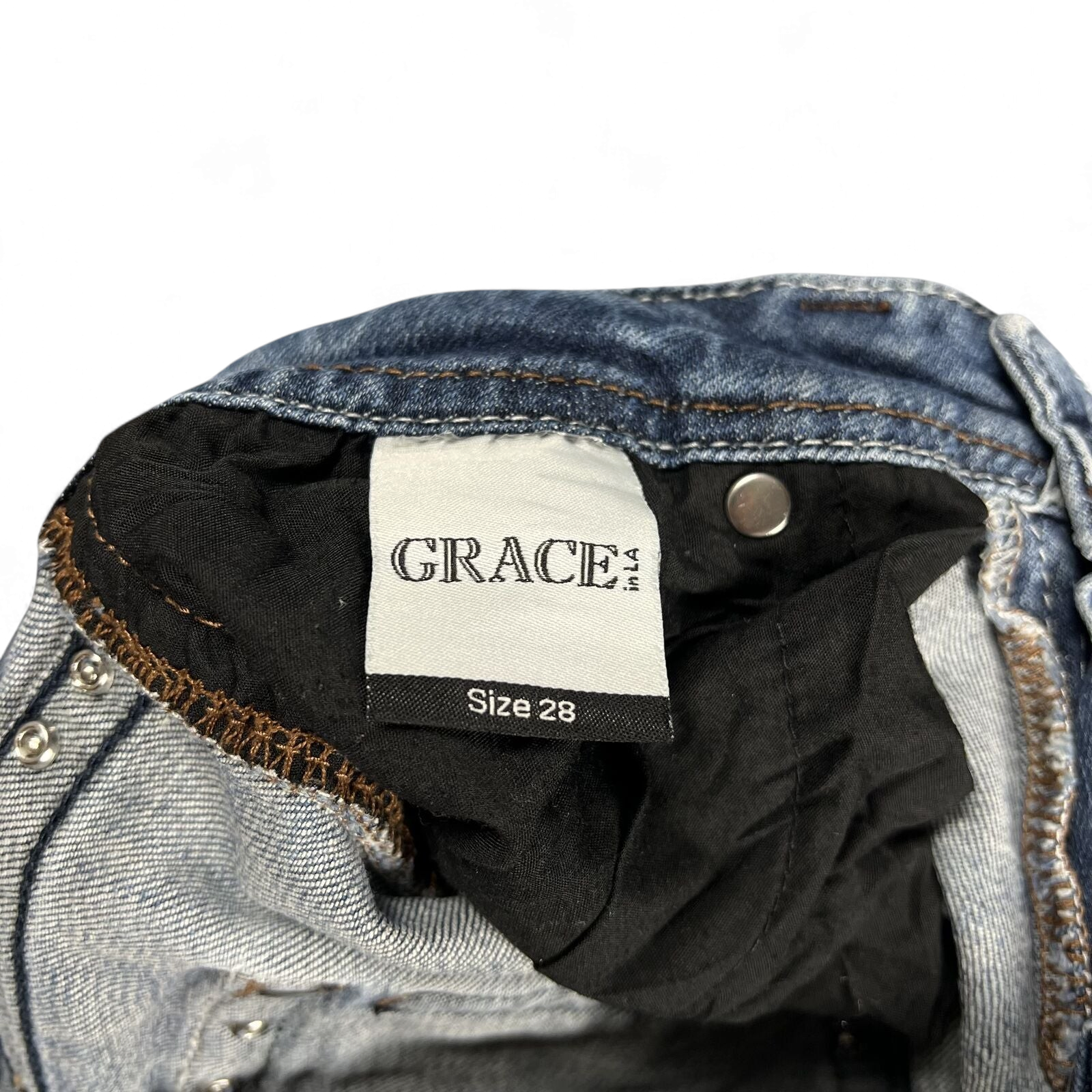 TWC Vintage Damen Y2K Bootcut Jeans mit Grace in LA Markenetikett und Größenangabe 28