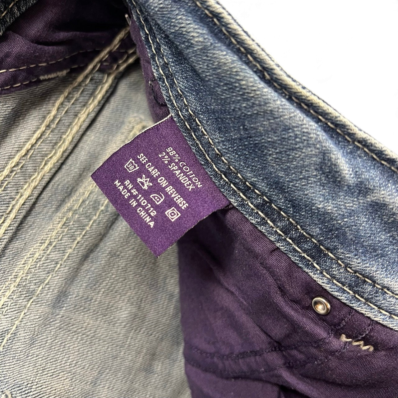 TWC Vintage Damen Y2K Bootcut Jeans Etikett mit Materialzusammensetzung aus Baumwolle und Elasthan