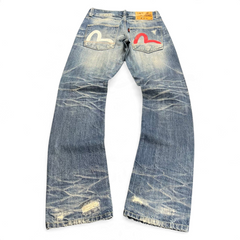 TWC Vintage Evisu straight leg jeans in distressed blue denim with iconic white and red painted back pocket seagull