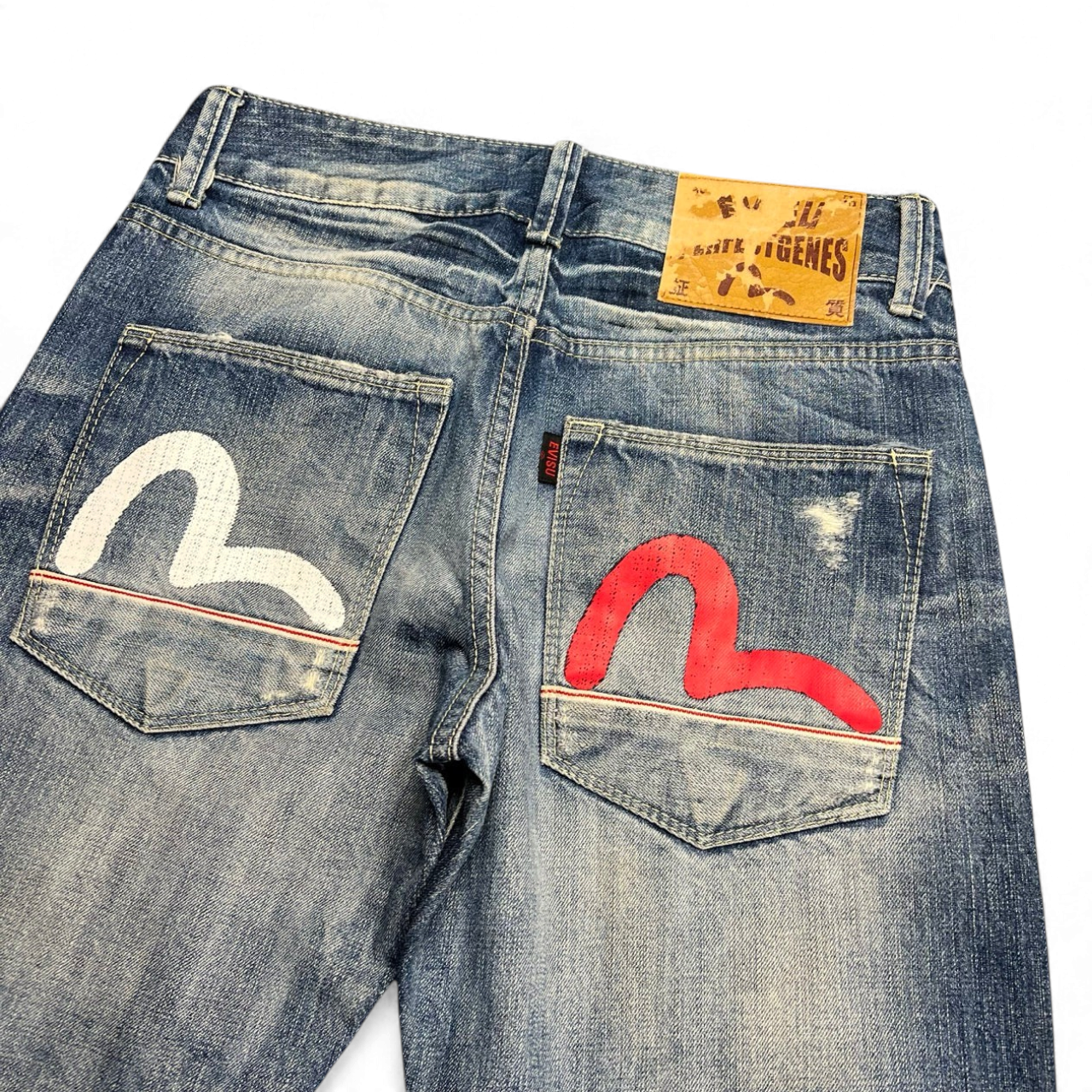 TWC Vintage Evisu straight leg jeans in distressed blue denim with iconic white and red painted seagull back pockets.