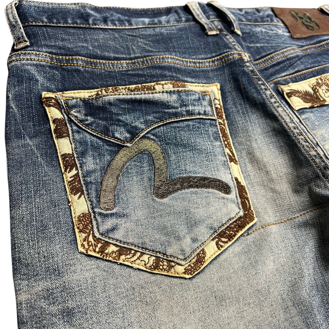 TWC Vintage Evisu straight leg blue denim jeans featuring a signature painted seagull logo and patterned pocket trim