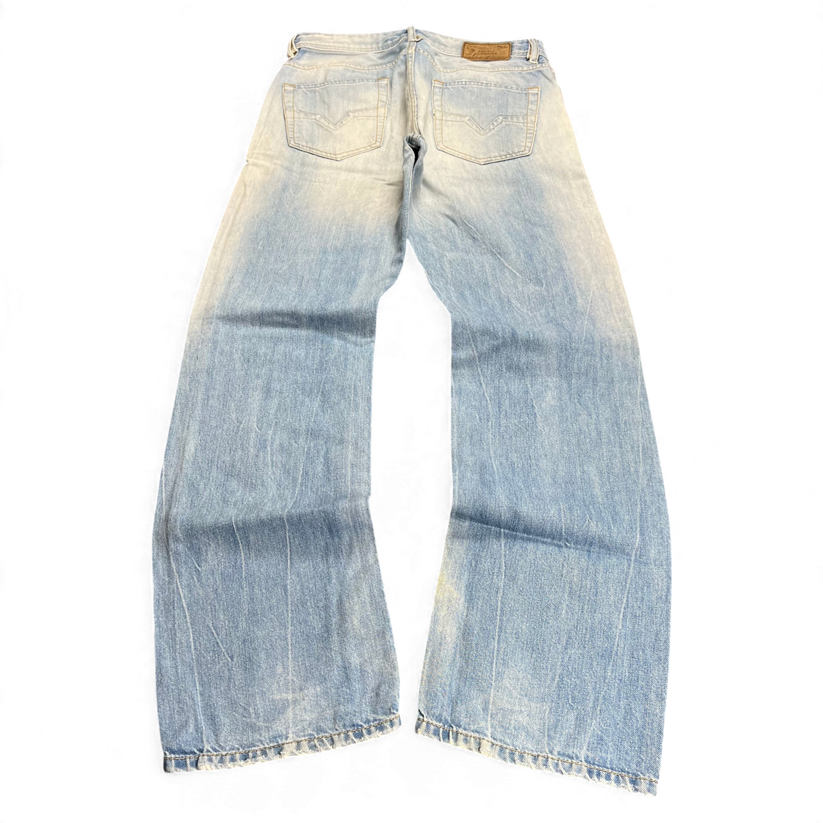 TWC Vintage Diesel Jeans in hellblauer Waschung mit geradem Bein, Rückansicht