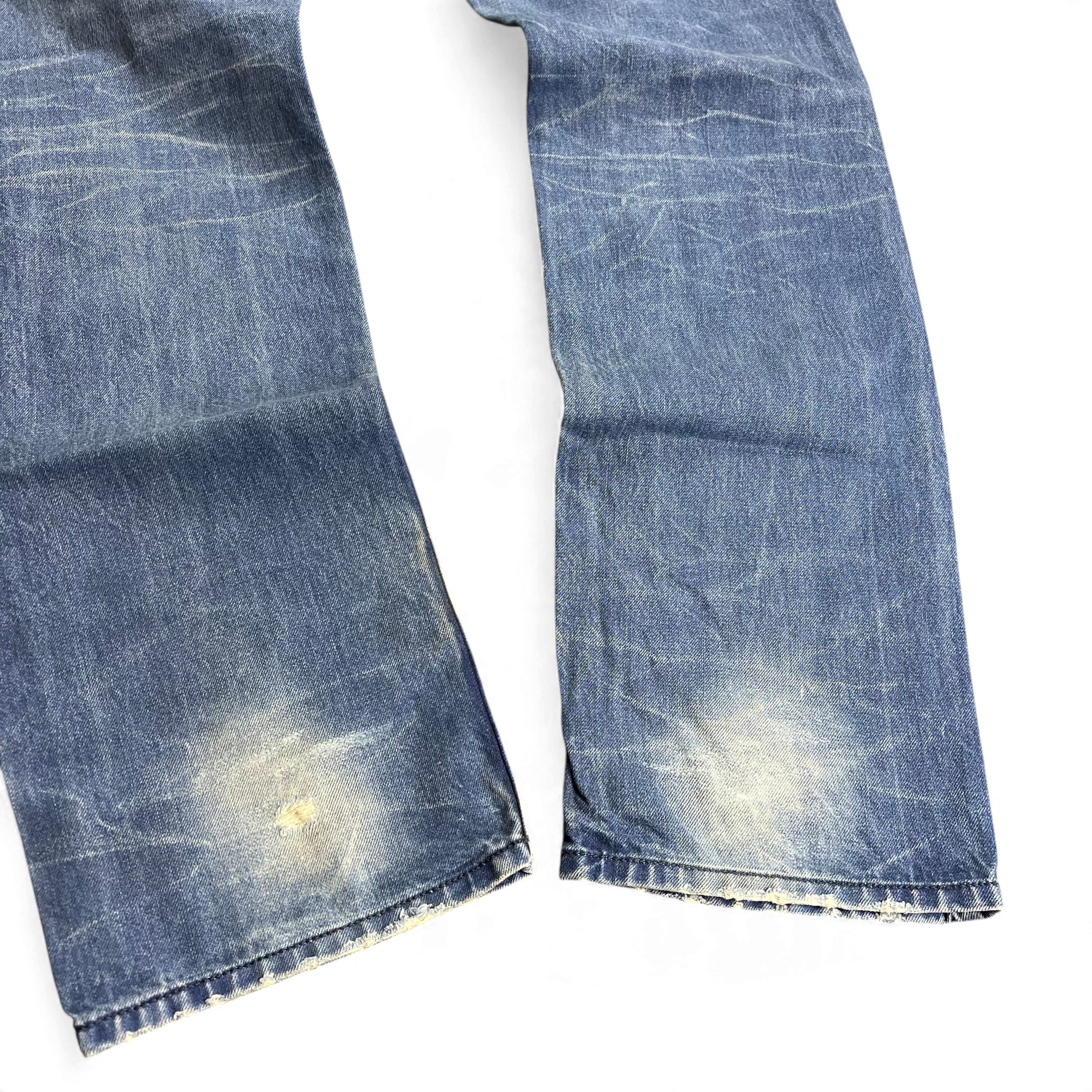 TWC Vintage Diesel Straight Jeans in verwaschenem Blau mit Distressed-Details und Abnutzungen an den Knien