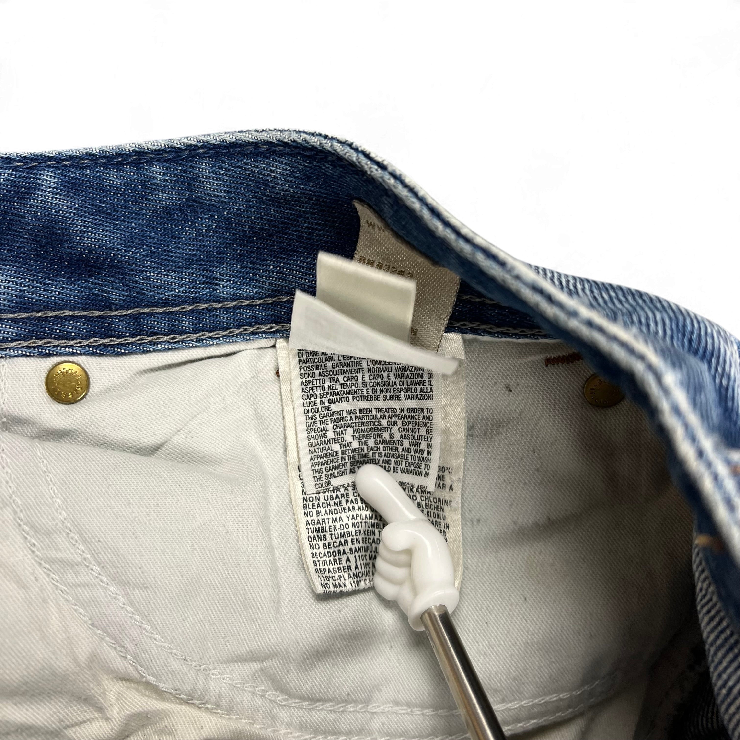 TWC Vintage Diesel Zaghor Bootcut Jeans Pflegeetikett mit Waschanleitung und Materialinformationen