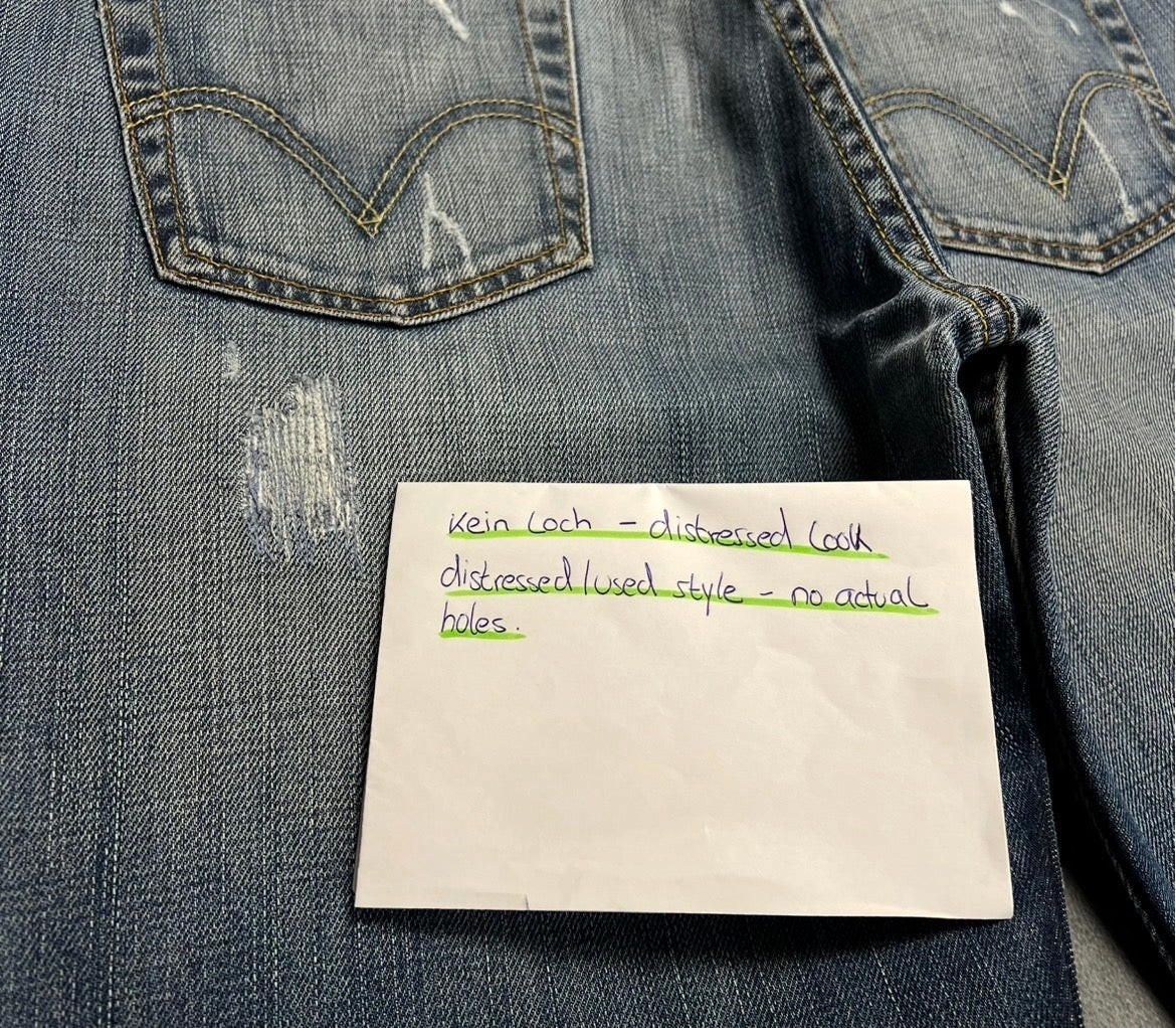 TWC Vintage Levi's 512 Bootcut Jeans in grau mit Distressed-Optik und markanten Gesäßtaschen-Details