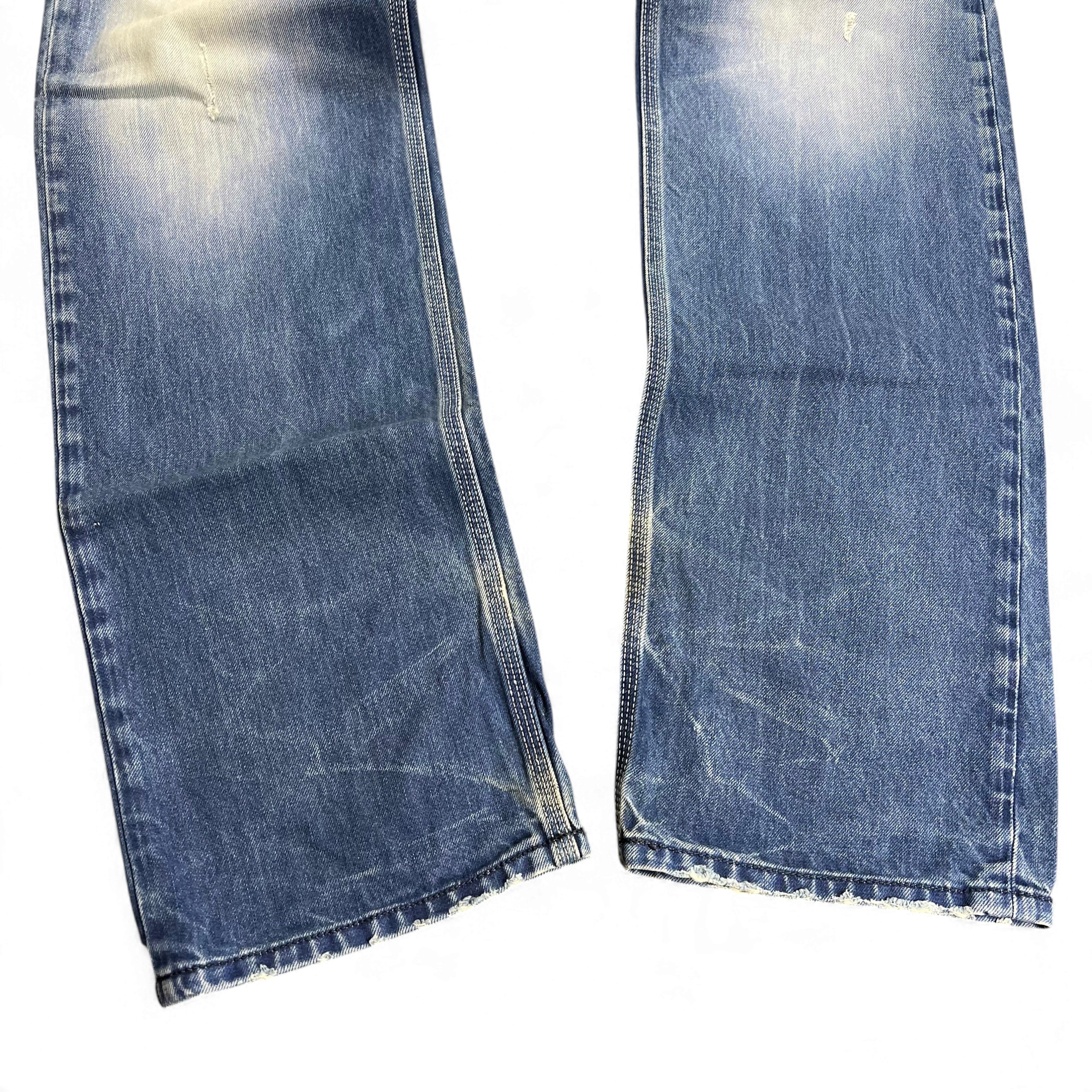 TWC Vintage Diesel Straight Jeans in verwaschenem Blau mit Distressed-Details und geradem Beinverlauf