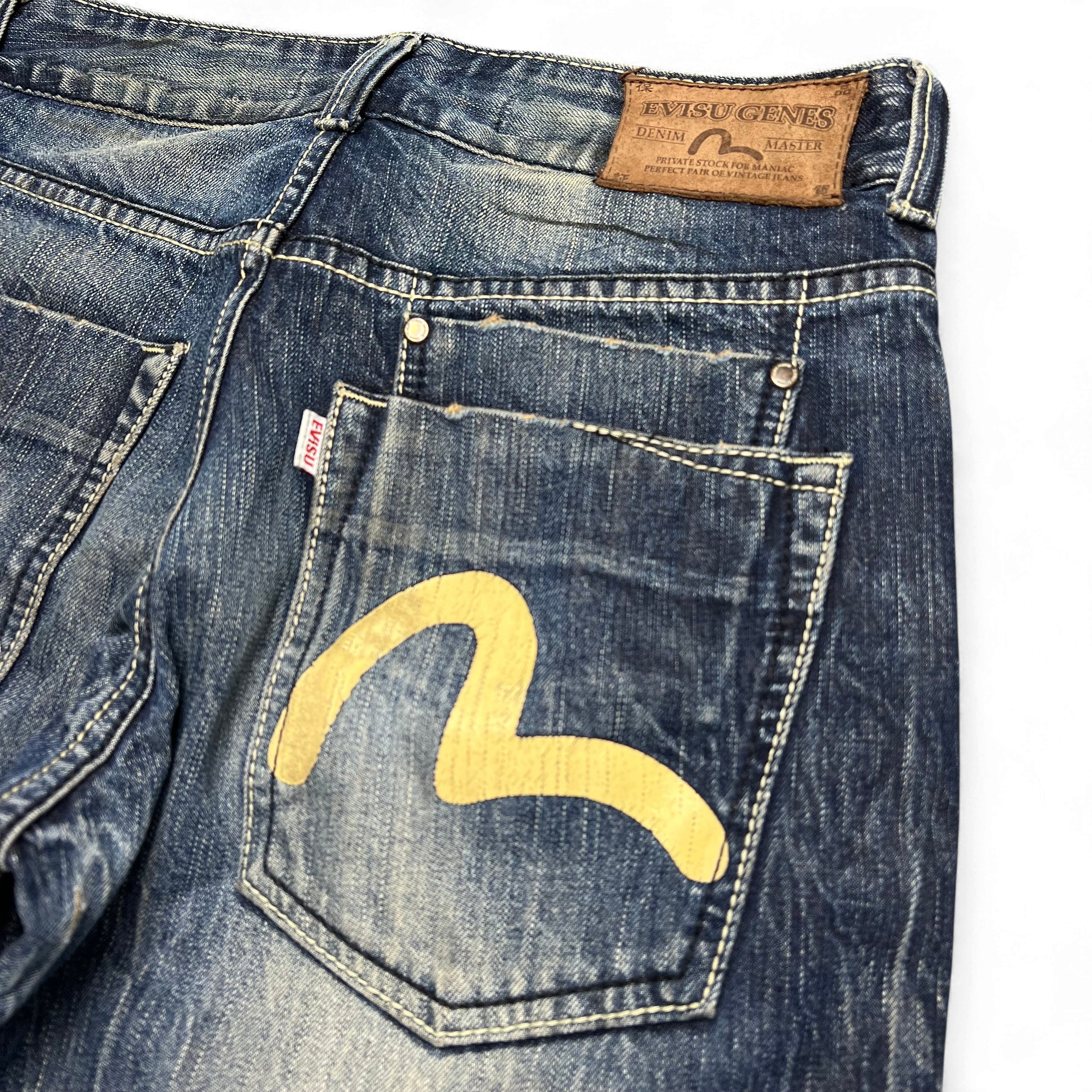 TWC Vintage Evisu KC Straight Jeans in blauem Denim mit ikonischem gelbem Möwen-Logo auf der Gesäßtasche