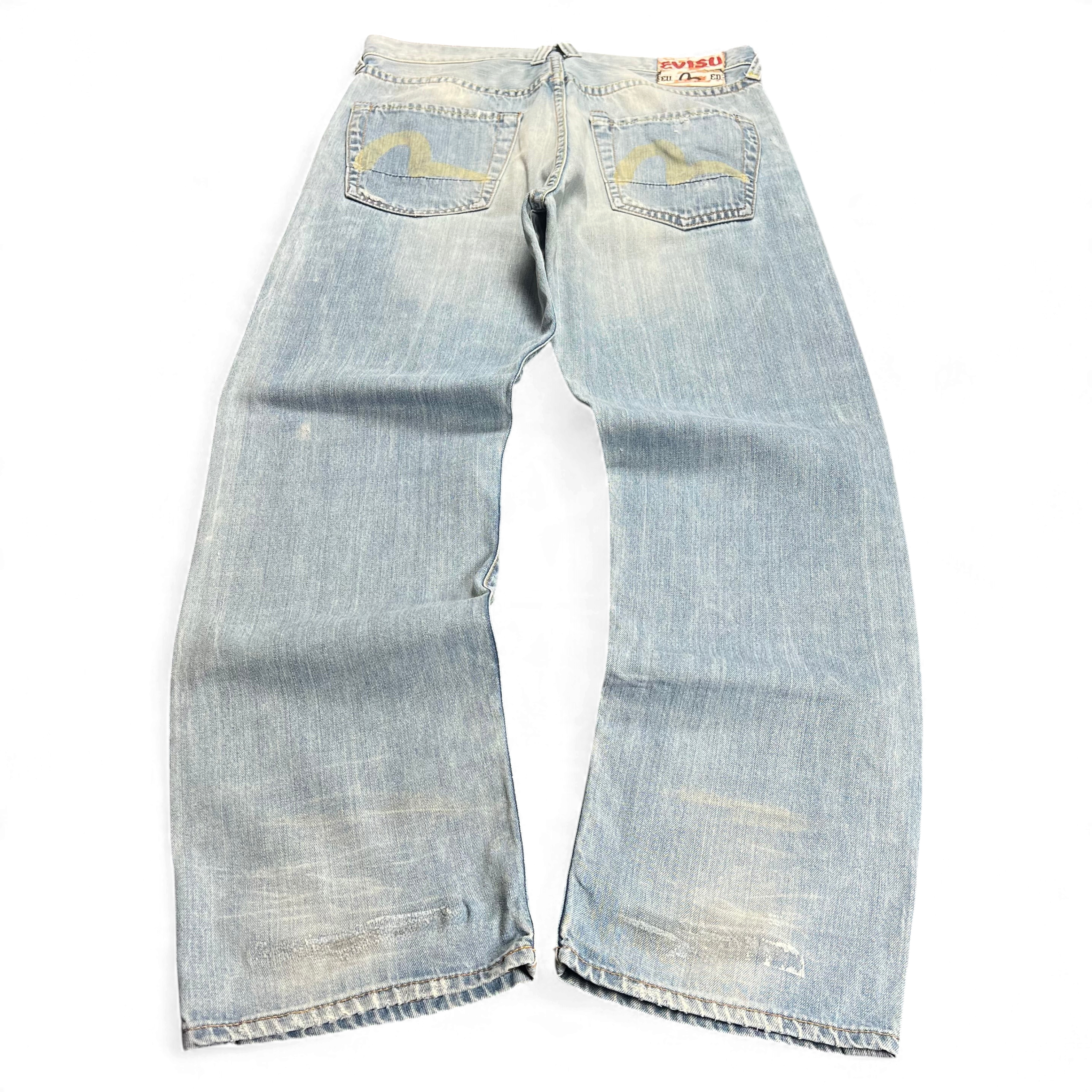 TWC Vintage Evisu Jeans in hellblauem Denim mit Distressed-Optik und charakteristischem Seagull-Print auf den Taschen