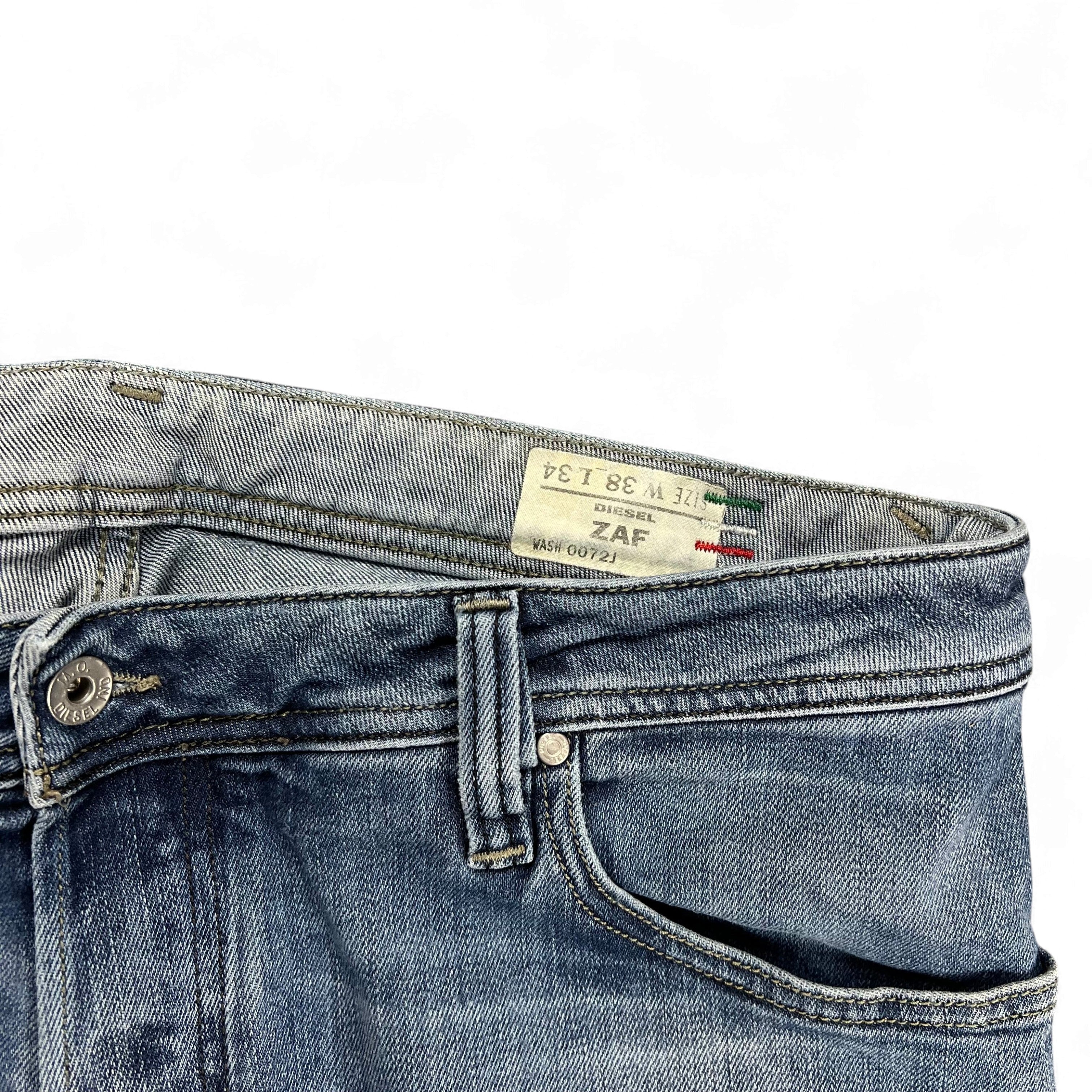 TWC Vintage Diesel Zaf Bootcut Jeans in blauem Denim mit Etikett am Bund und klassischem Knopfverschluss