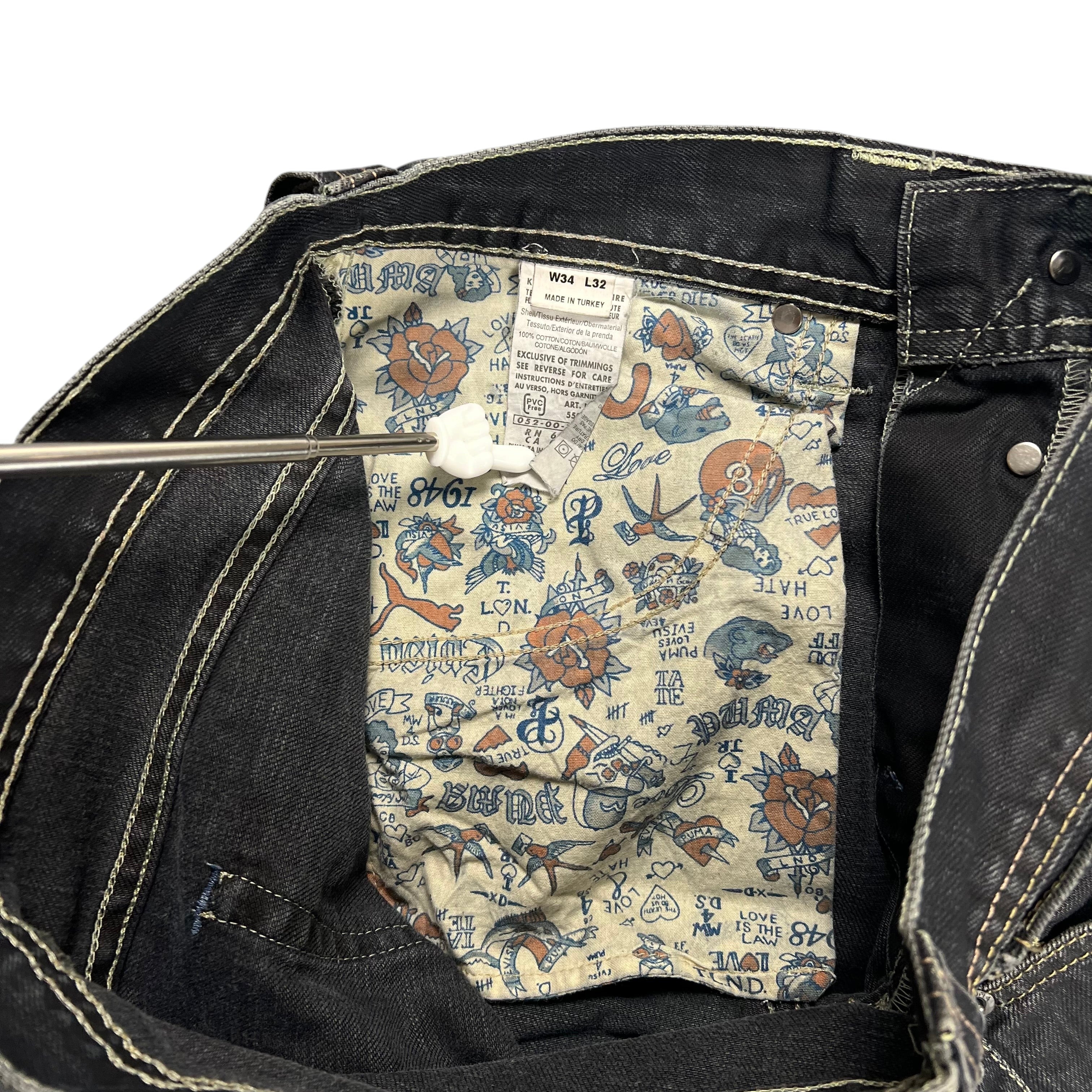 TWC Vintage Evisu x Puma Bootcut Jeans mit bedrucktem Innenfutter und Größenetikett W34 L32