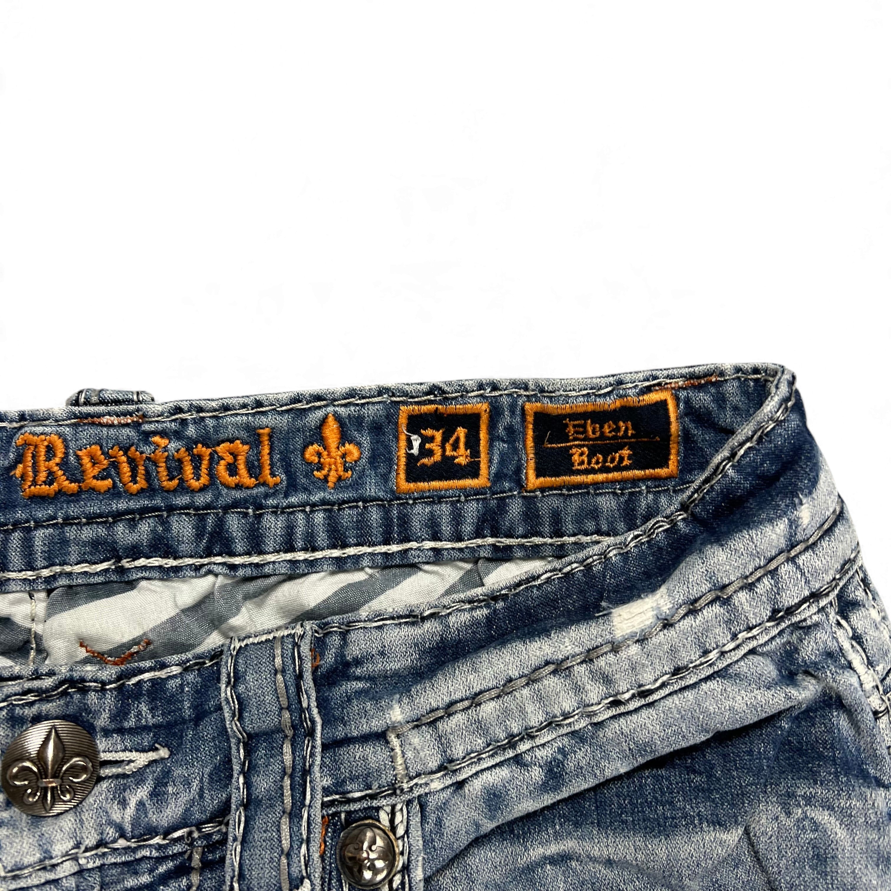 TWC Vintage Rock Revival Bootcut Jeans mit verwaschenem Denim und orangefarbenen Stickereien am Bund