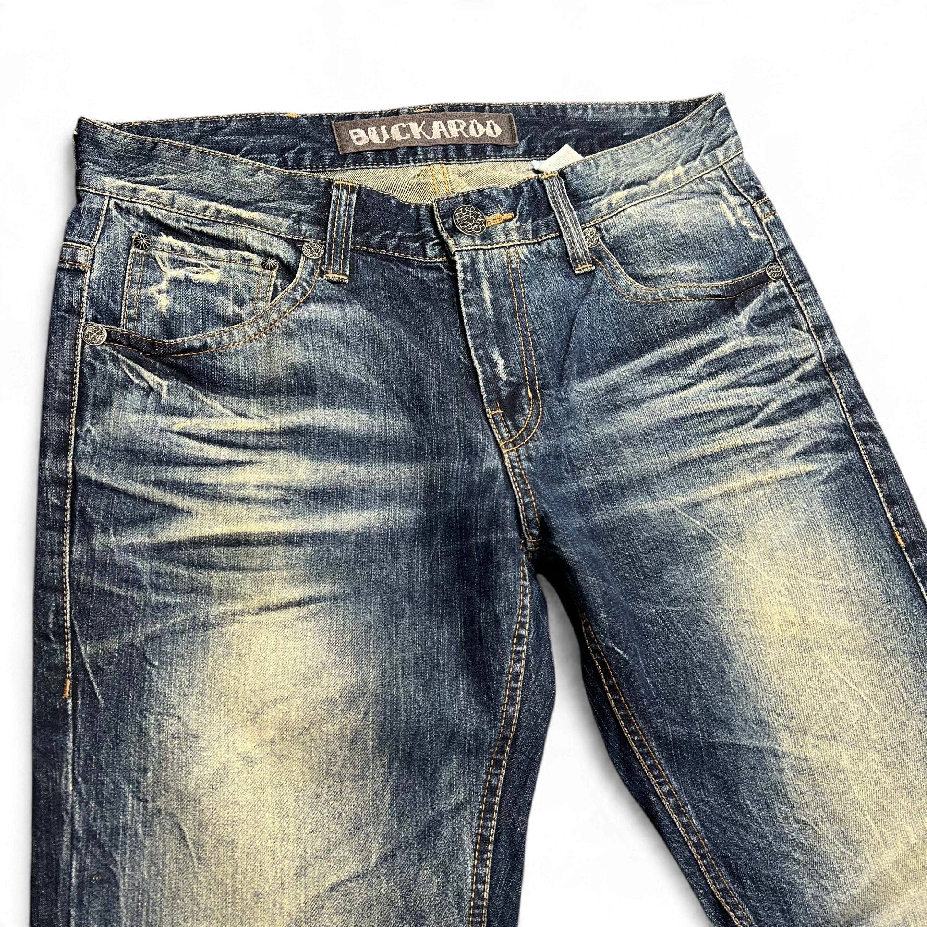 TWC Vintage Buckaroo Bootcut Jeans in verwaschenem Blau mit Distressed-Details und klassischem Knopfverschluss